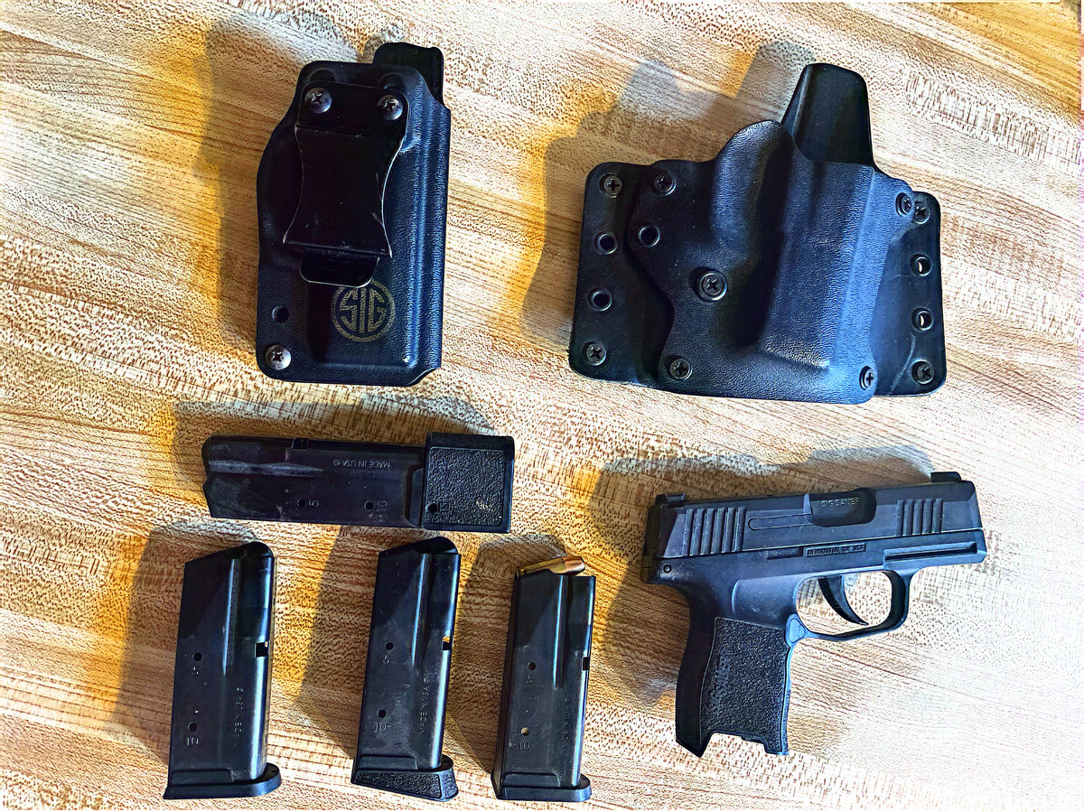 Used SIG Sauer P365 with two Kydex holsters and four magazines